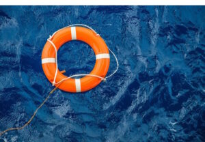Orange buoy on drak blue waters