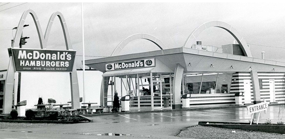 Vintage black and white photo of a McDonald's restaurant, circa the 1950s.
